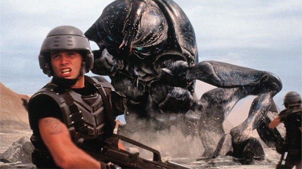 Starship Trooper flees from a giant bug